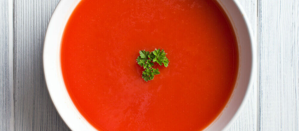 Tomato,Soup,On,Kitchen,Table.,Top,Shot